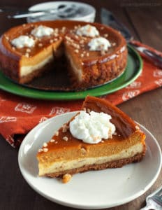 pumpkin pie toffee cheesecake with whipped topping on top
