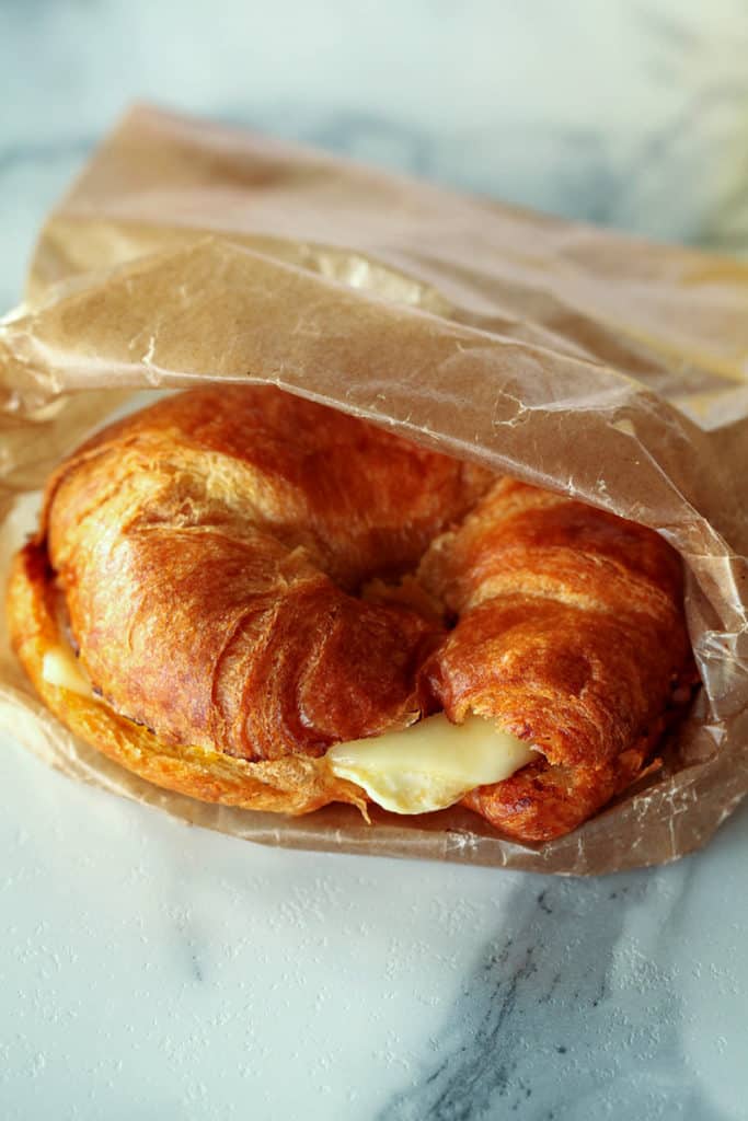 Toasted croissant with ham, egg and cheese
