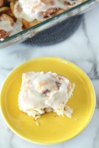 Overnight Cinnamon Roll on a yellow plate