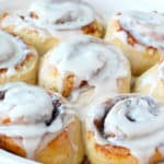 frozen bread dough made into easy cinnamon rolls with frosting and baked in a pie plate