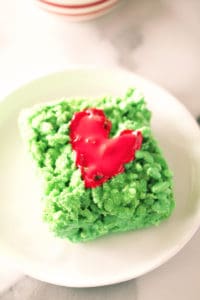 piece of grinch marshmallow treat on a white plate