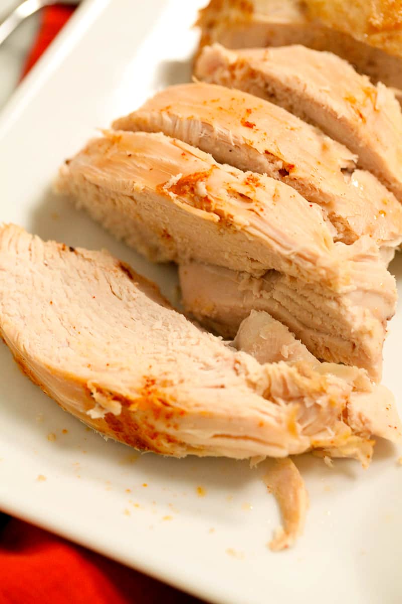 four pieces of sliced instant pot turkey breast on a serving platter