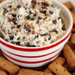 closer image of chocolate chip dip in a bowl and a plate of graham cracker sticks