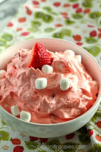 white bowl with strawberry fluff salad
