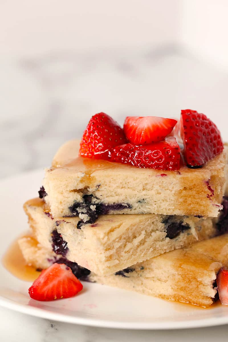 sheet pan pancakes with strawberries and blueberries