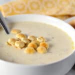 white bowl full of new england clam chowder