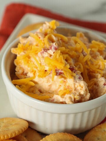 Ramekin with pimento cheese and round butter crackers